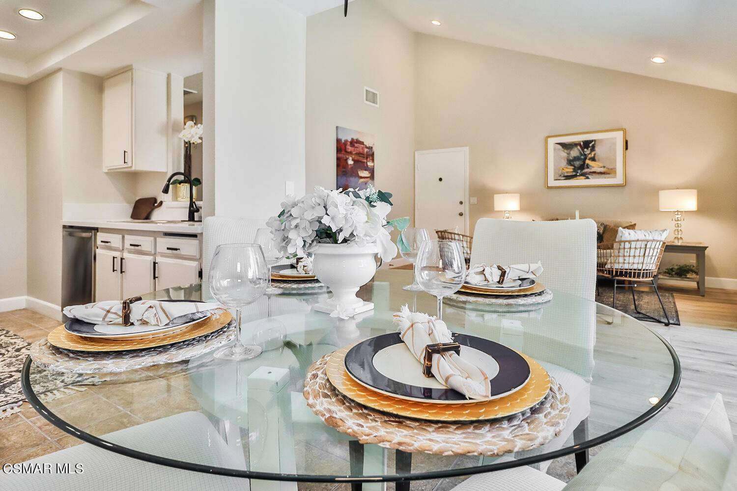 a dining room with a table and chairs