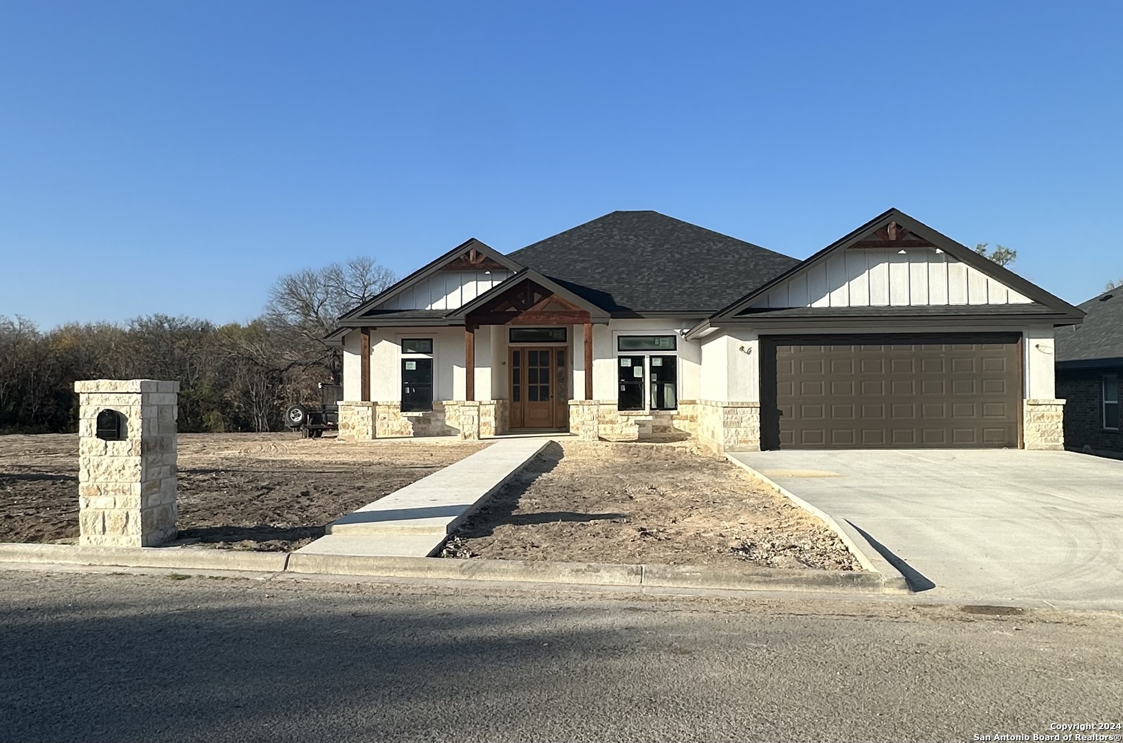 a view of house with yard