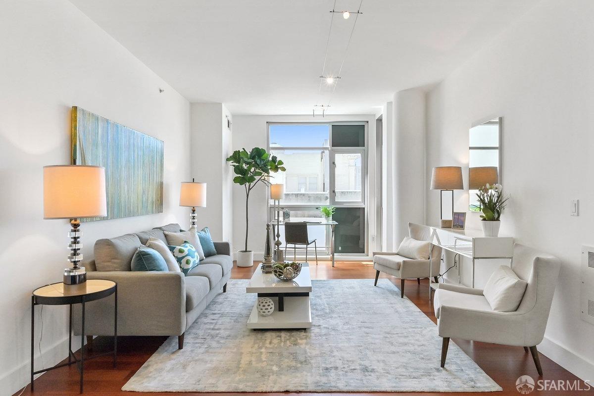 a living room with furniture and a potted plant