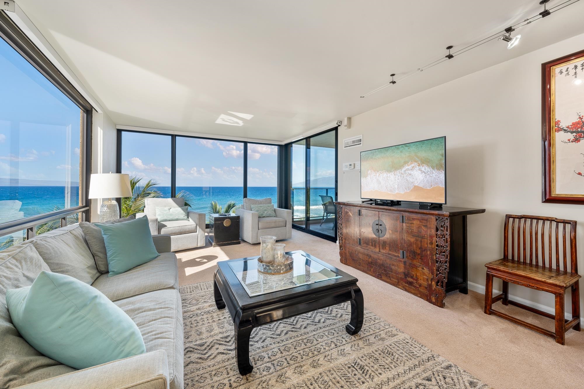 a living room with furniture and a flat screen tv