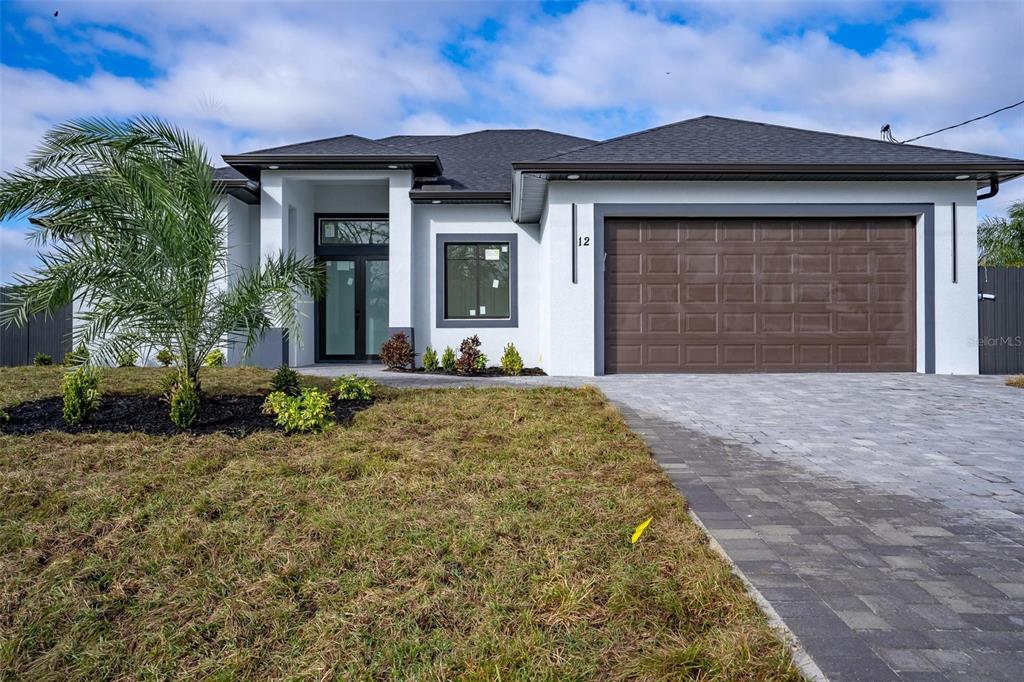 a front view of a house with a yard