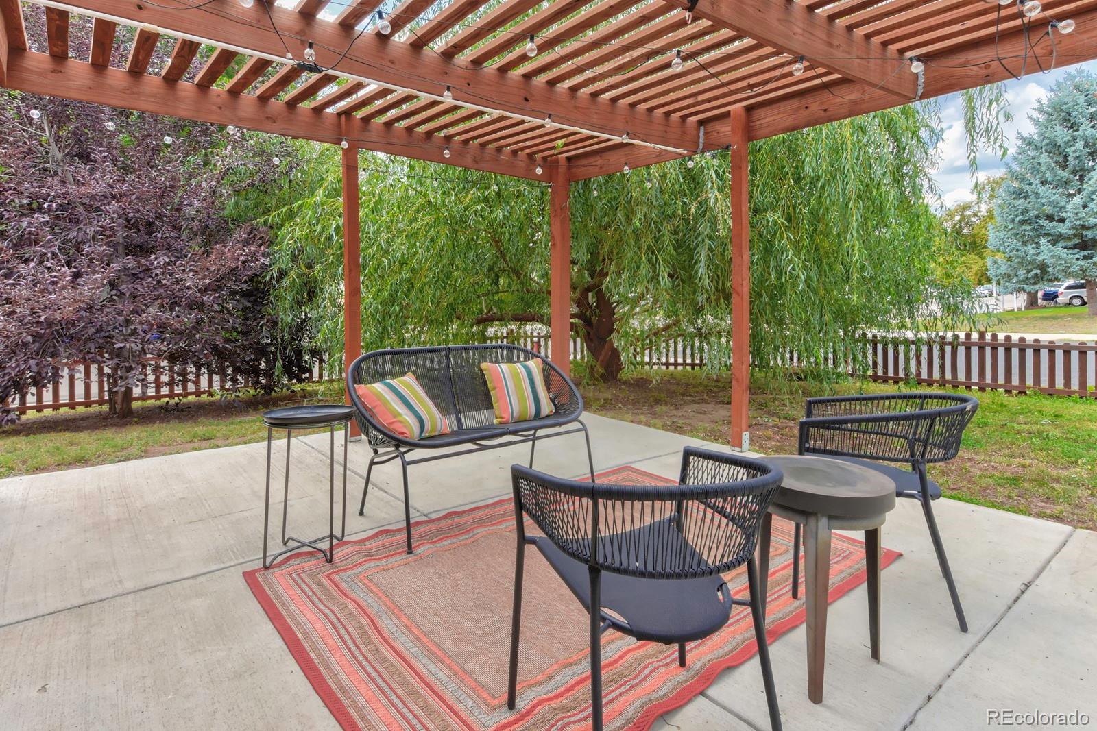 a view of a patio with a table chairs and a patio