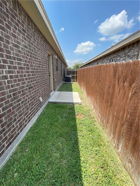 a view of a backyard with pathway