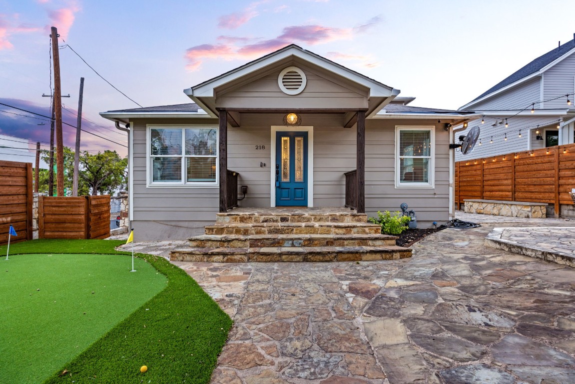 a front view of a house with garden