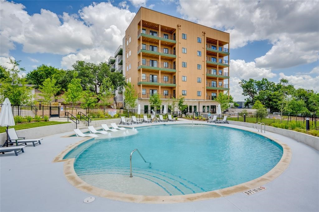 a view of swimming pool with outdoor space and seating area