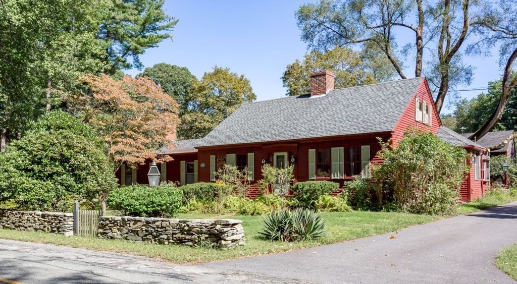 front view of a house with a garden