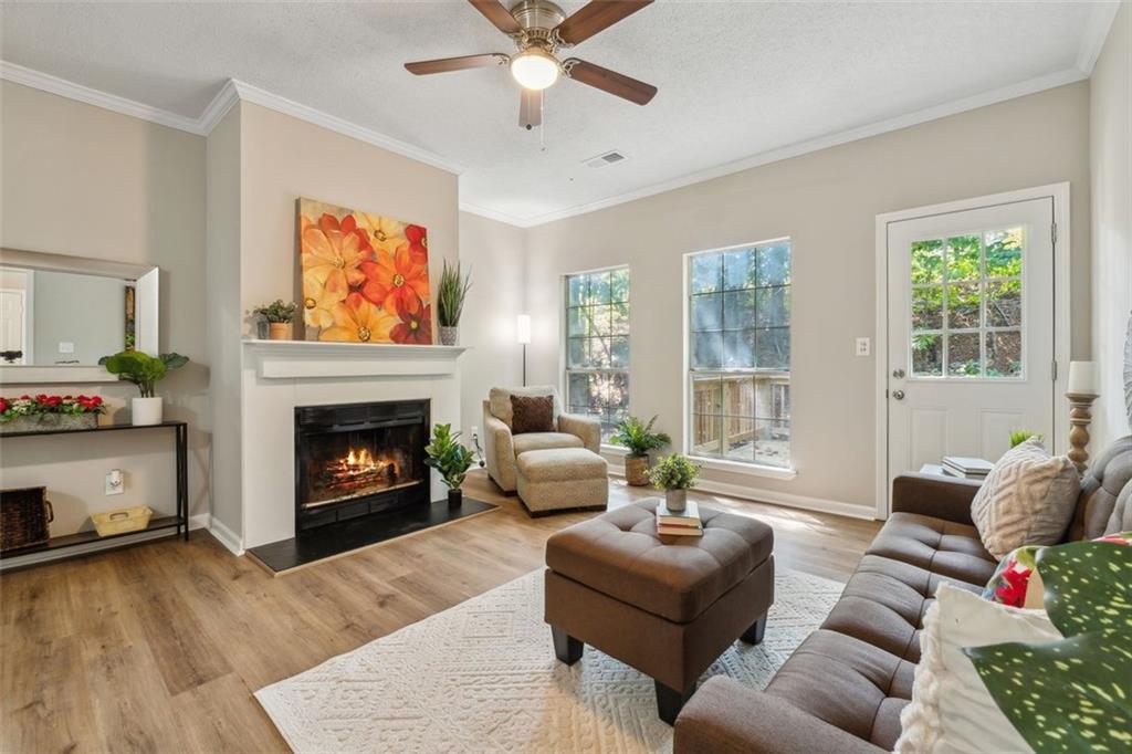 a living room with furniture and a fireplace