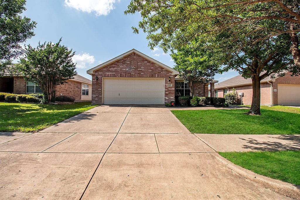 a front view of a house with yard