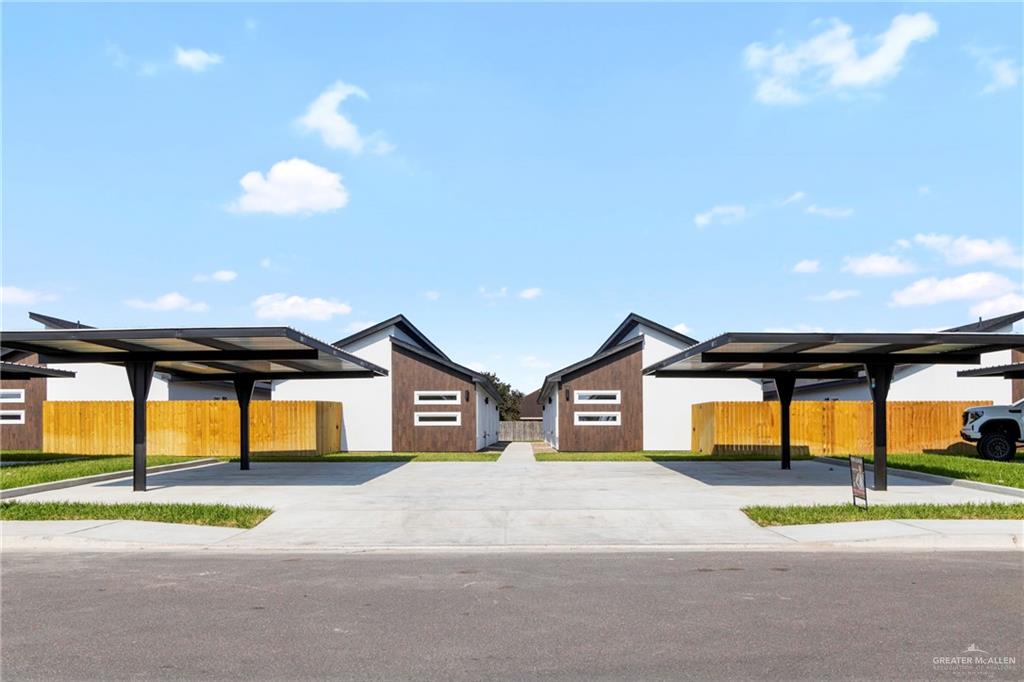 View of front of property featuring a carport