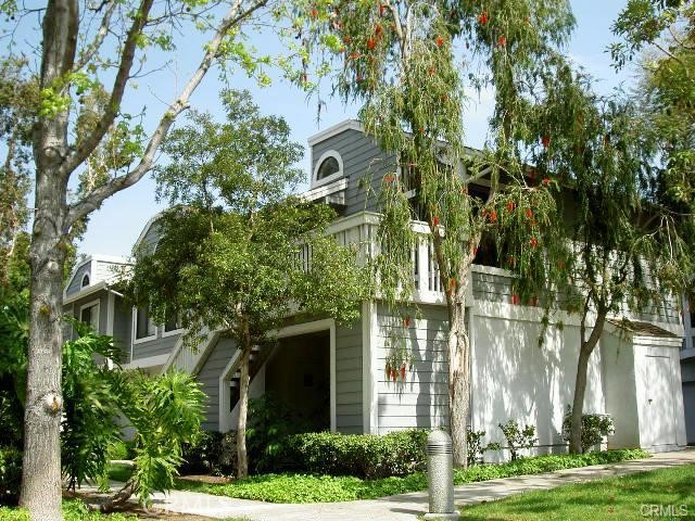 front view of a house with a tree