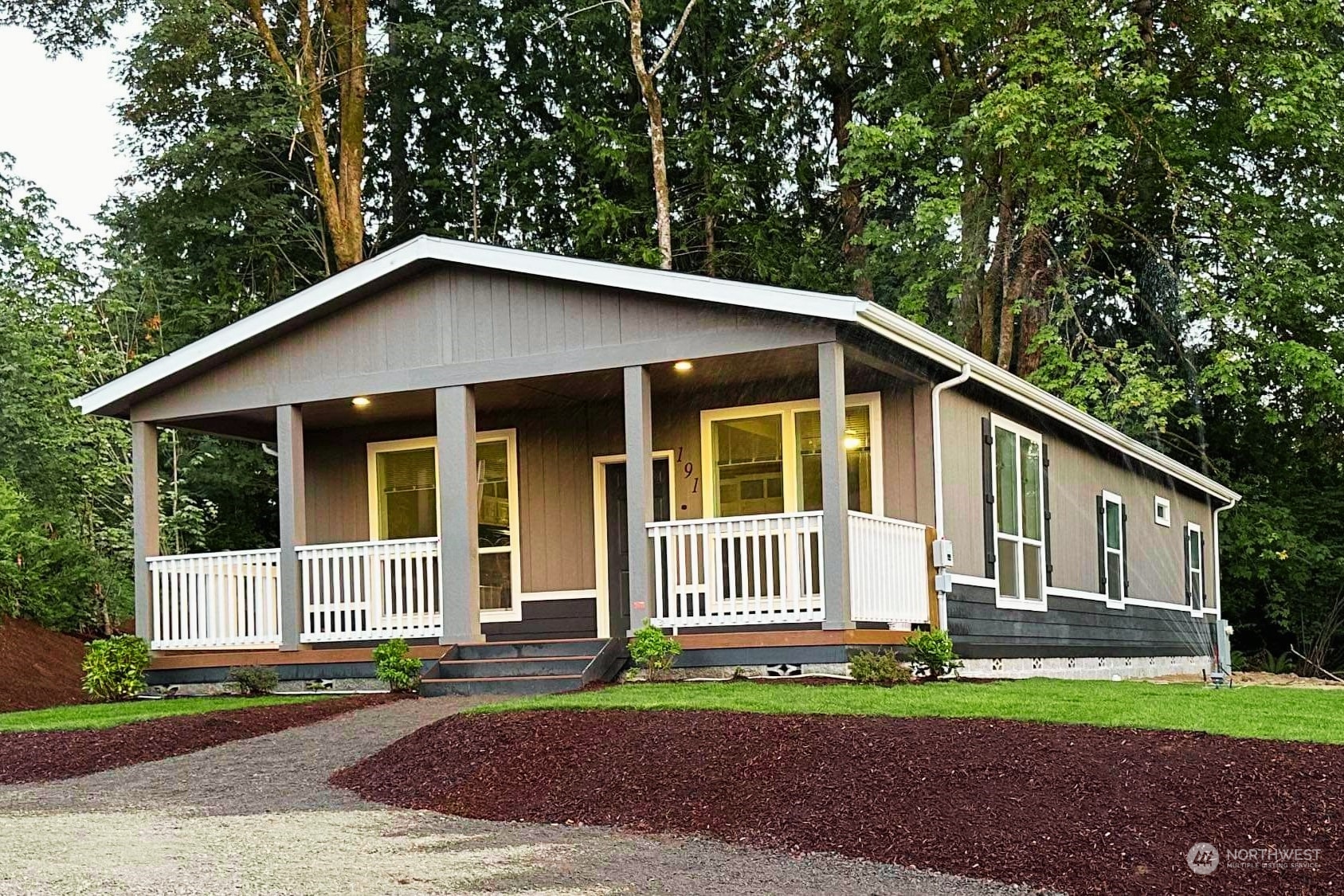 a view of a house with a yard and fence