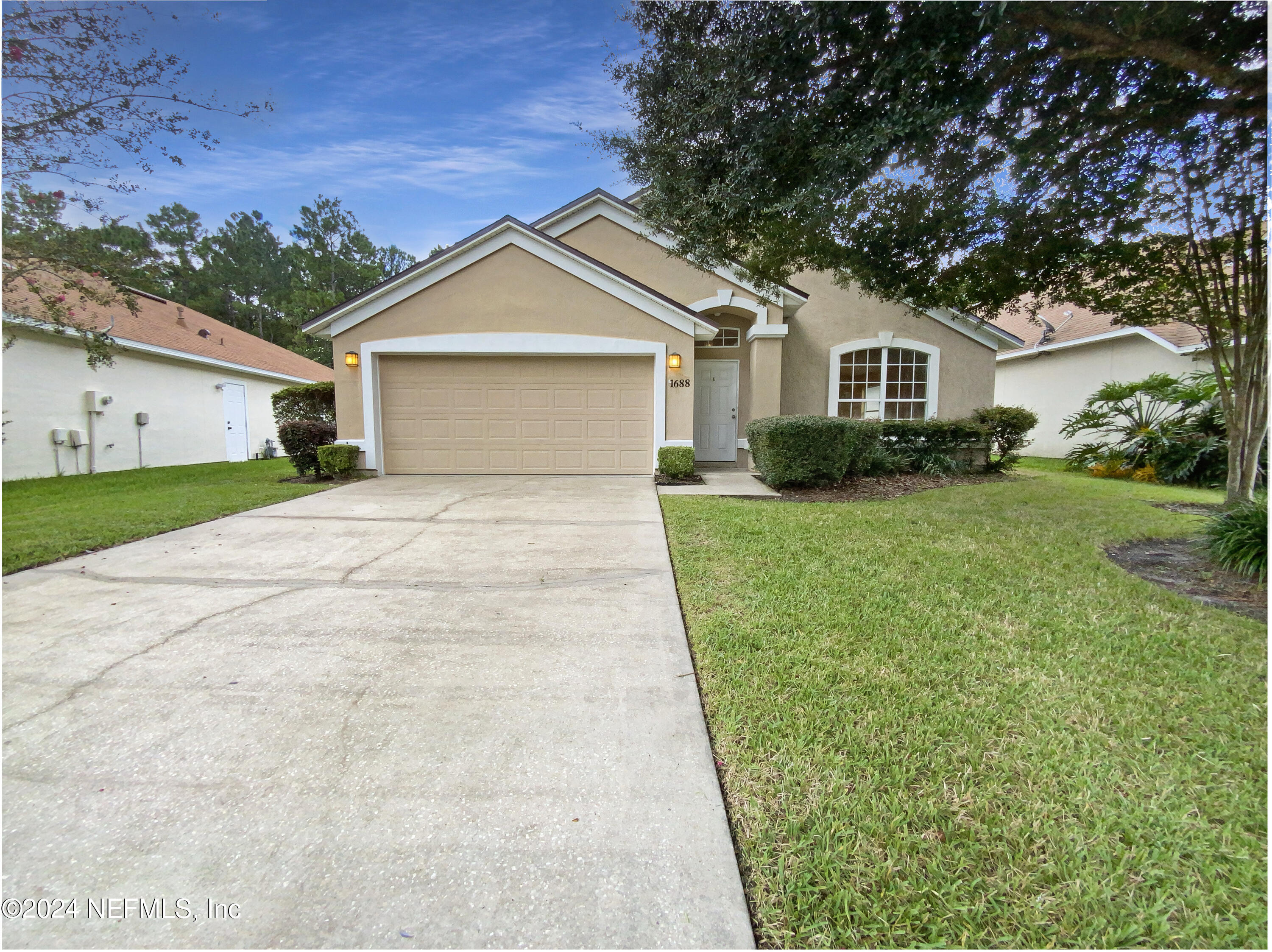 a front view of a house with yard