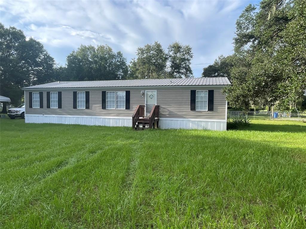 a house view with outdoor space and sitting space