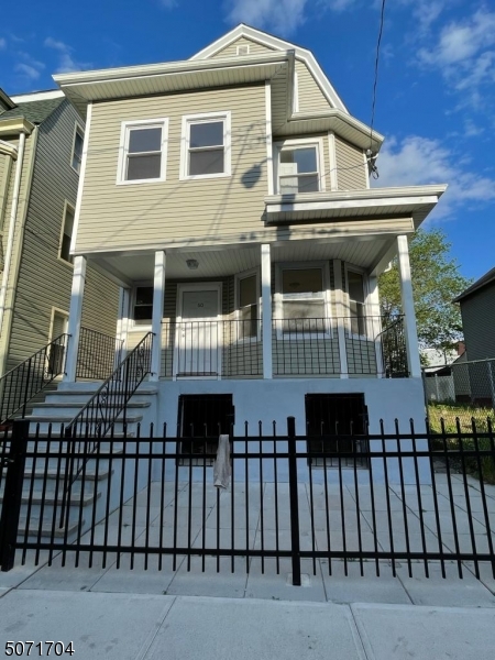 a front view of a house with a balcony