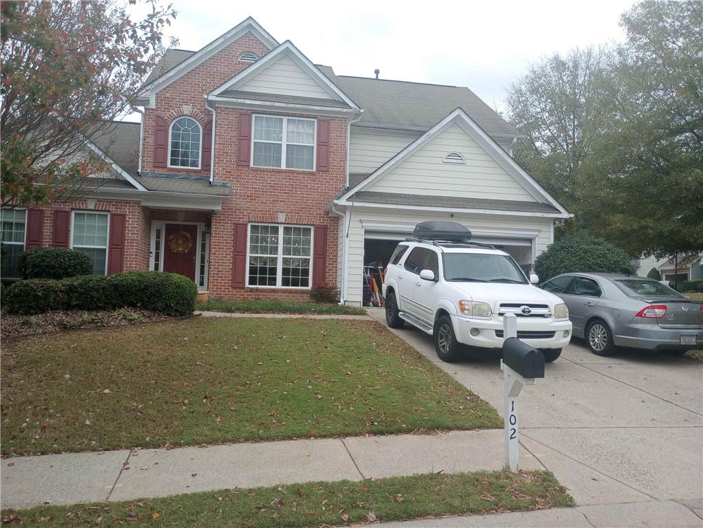 a view of a car parked in front of a house