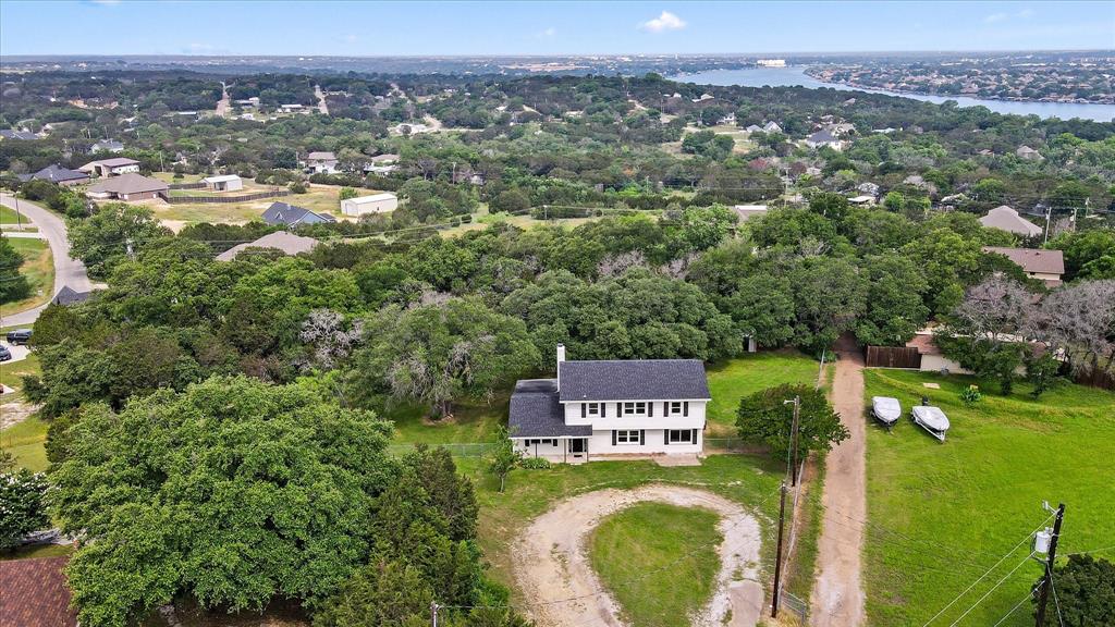 an aerial view of residential house with outdoor space and swimming pool