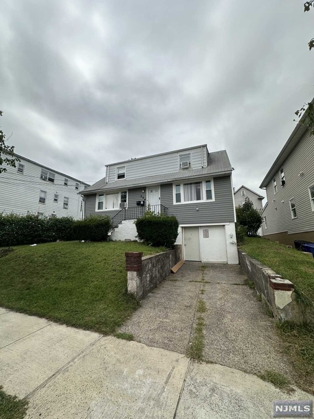 a view of a house with a back yard