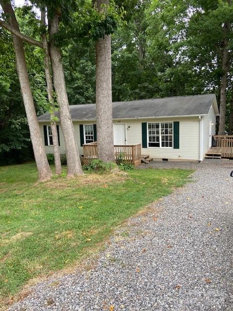 a house that has a tree in front of the house