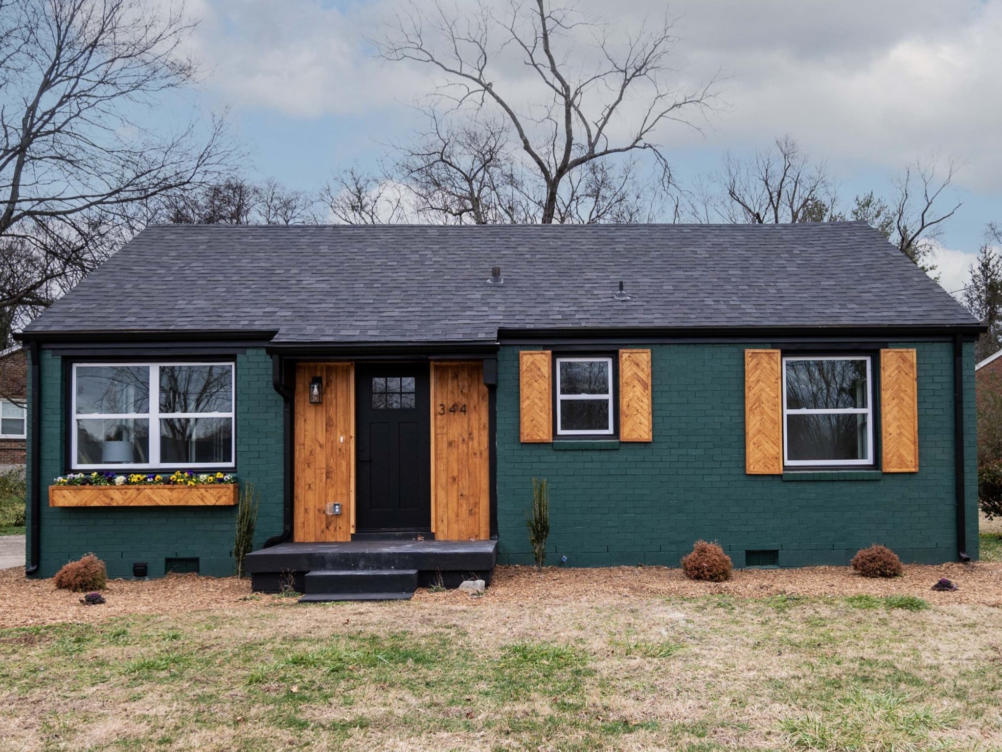 a front view of a house with a yard