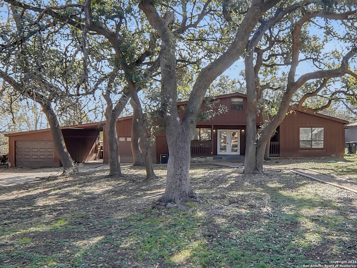 a view of a house with tree s