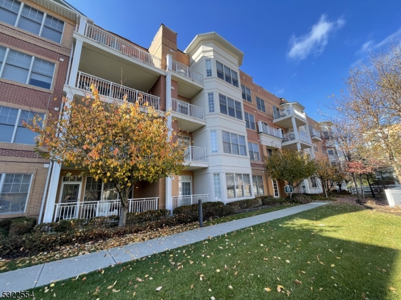 a view of a building with a yard