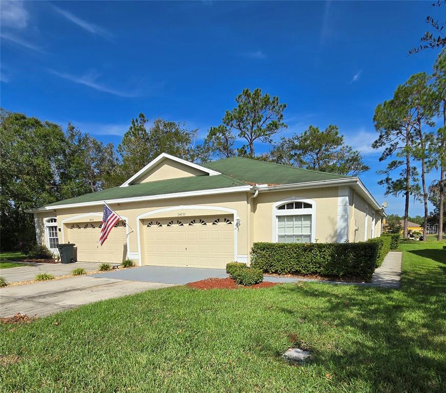 a view of front of house with a yard