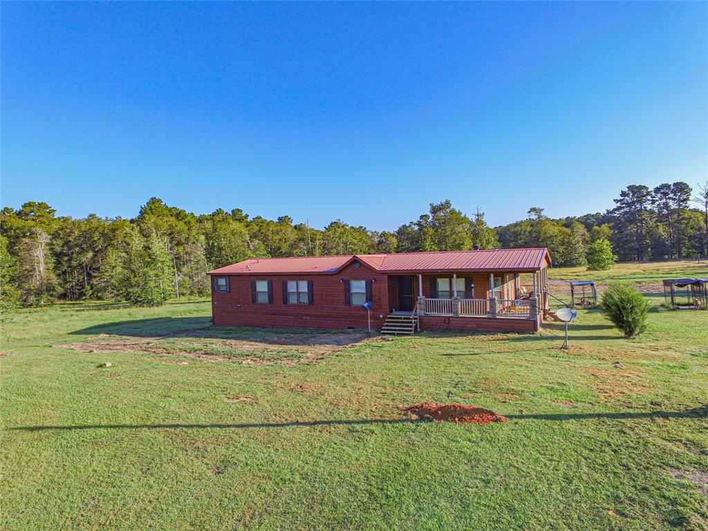 a view of a house with a big yard