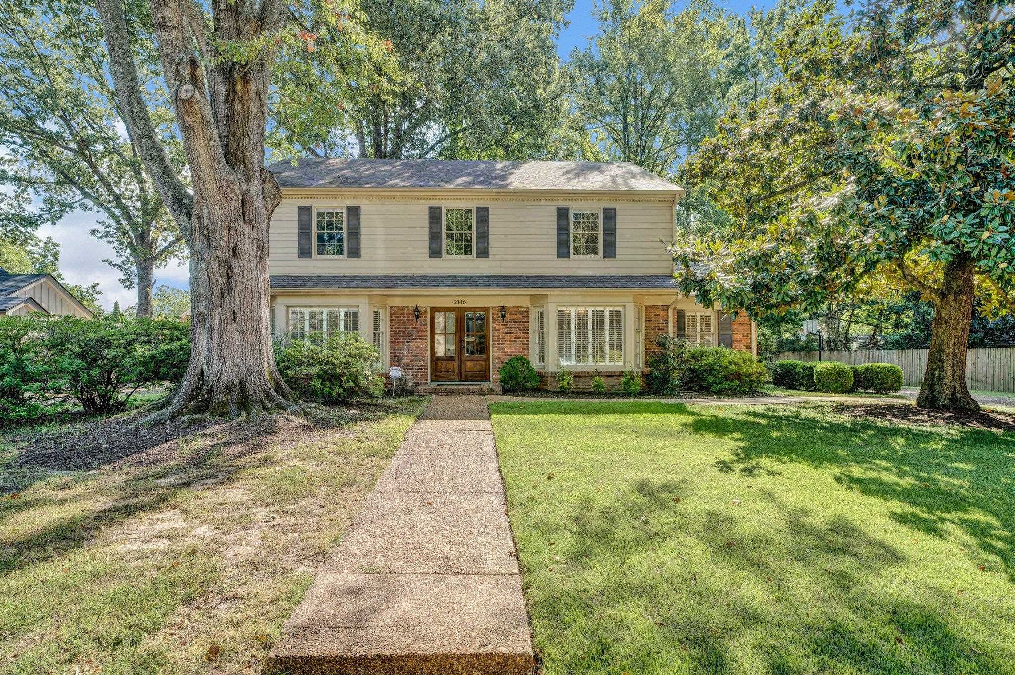 a view of a house with a yard