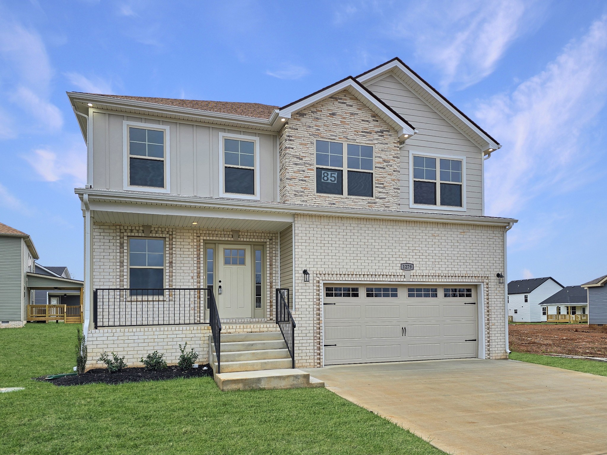 a view of a house with a yard and sitting space