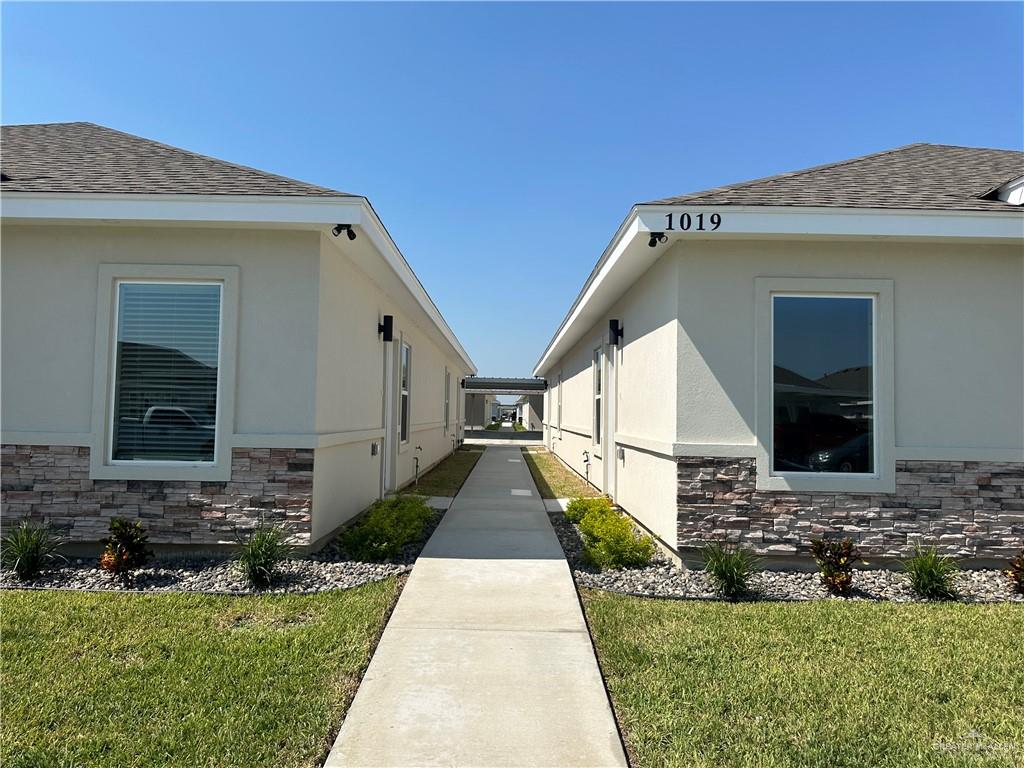 a view of house with yard