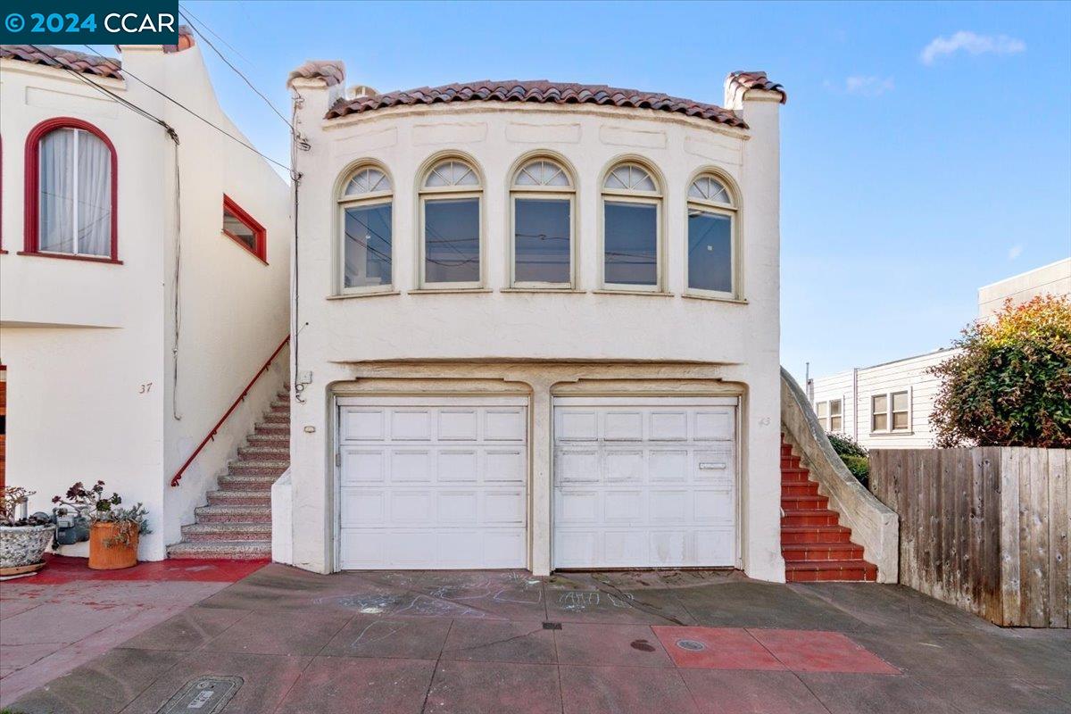 a view of a house with entryway and stairs