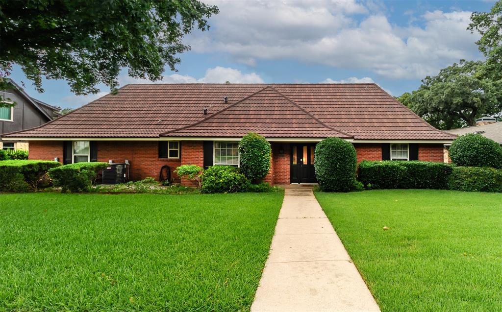 a front view of a house with yard