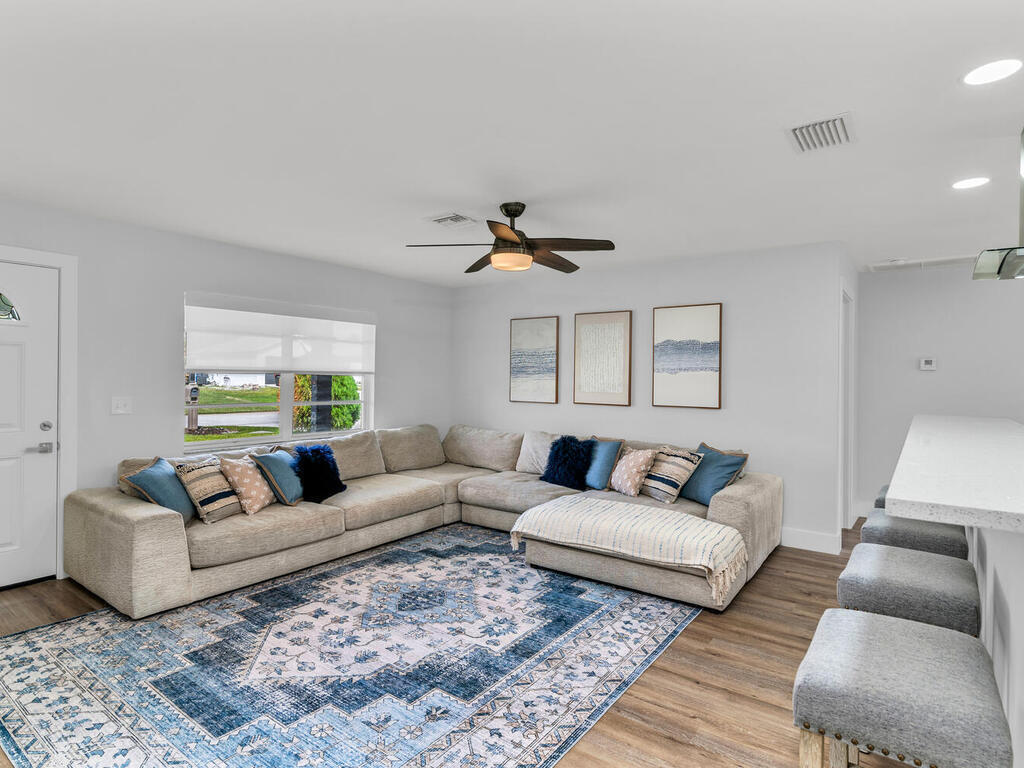 a living room with furniture and a rug