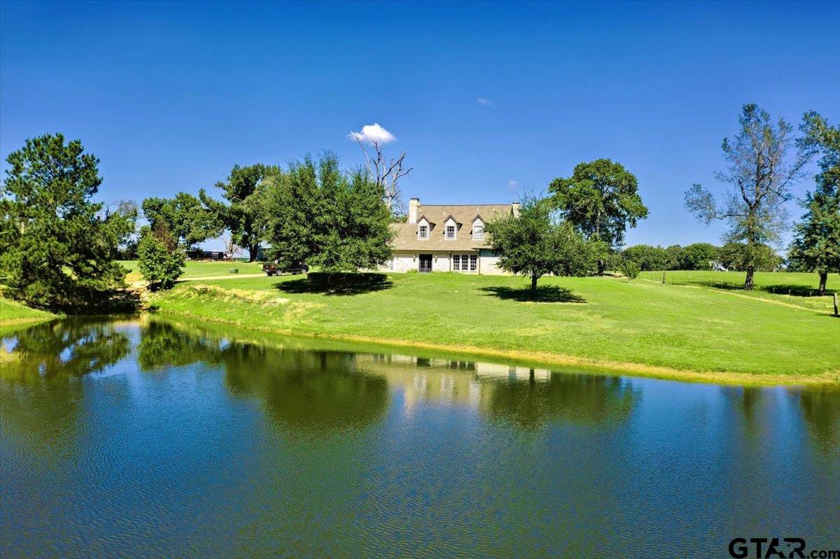 a view of a lake with a yard