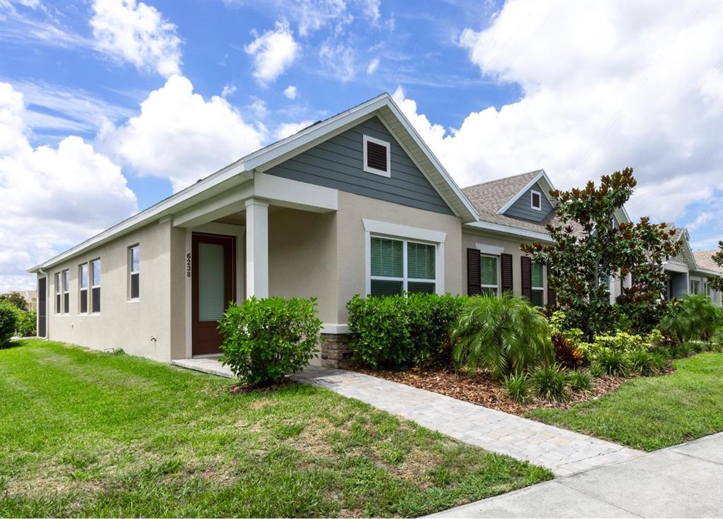 a front view of house with yard and green space