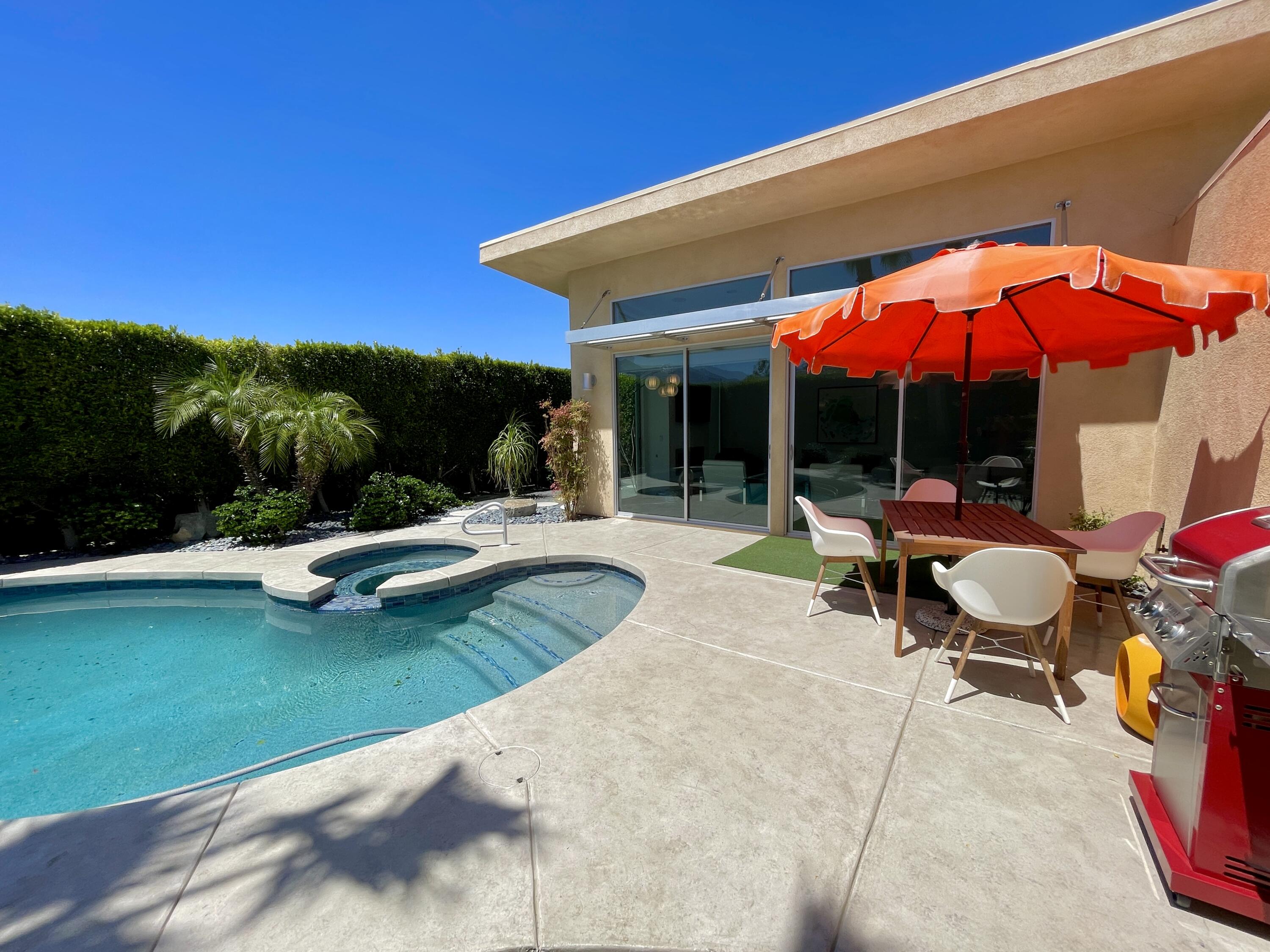 a view of swimming pool with a patio