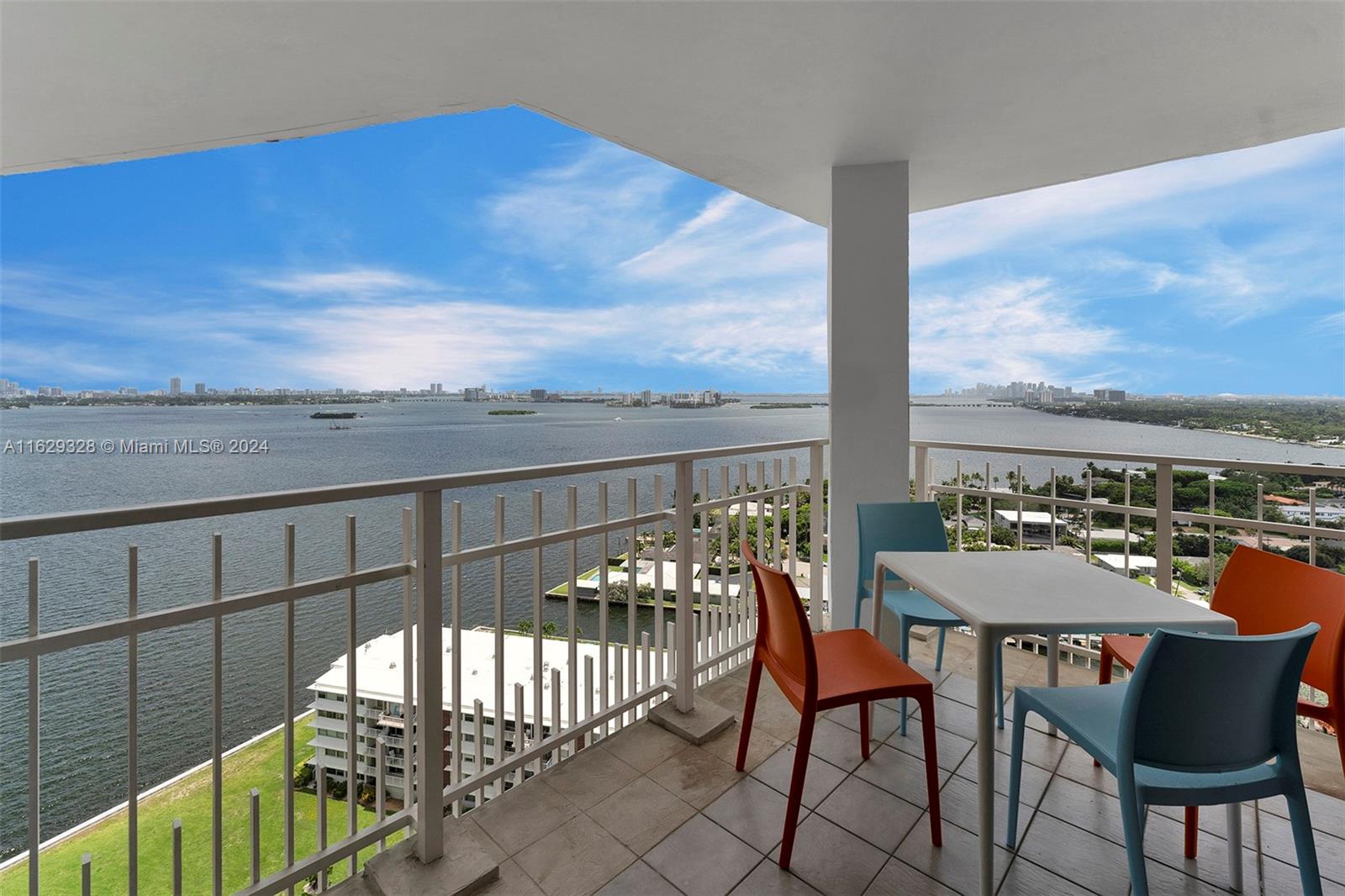 a view of a chairs and table in the balcony