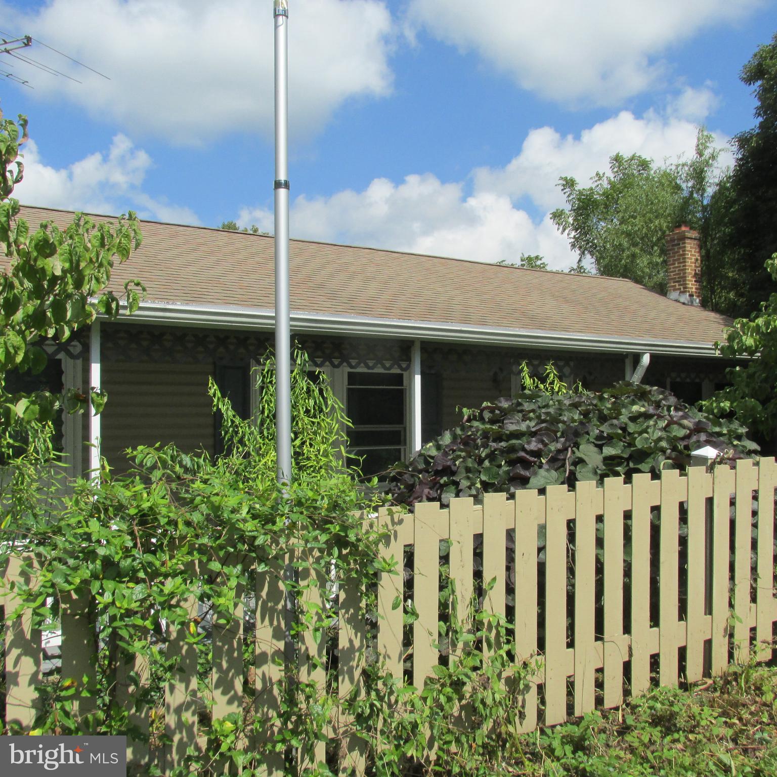 a house view with a garden space