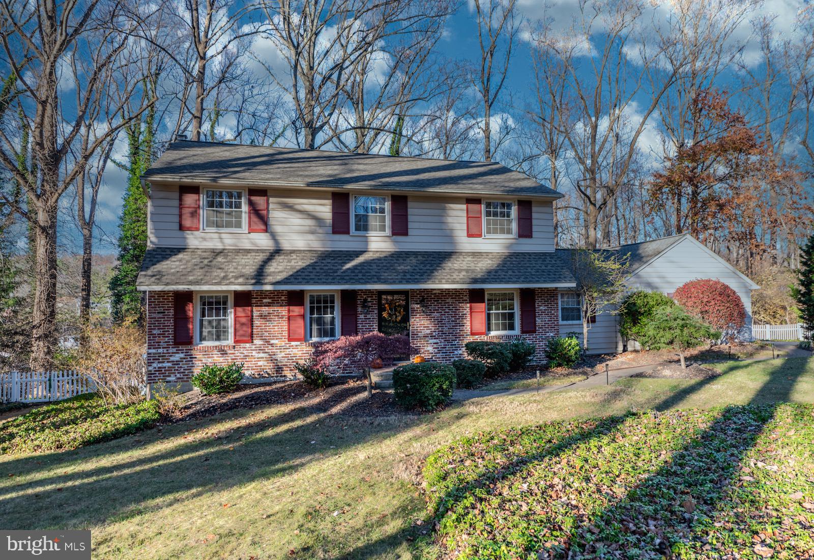 a front view of house with yard and outdoor seating