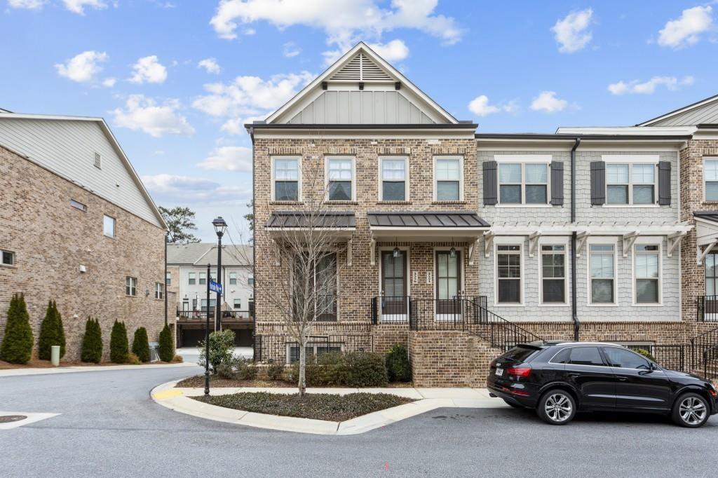 a car parked in front of a brick house