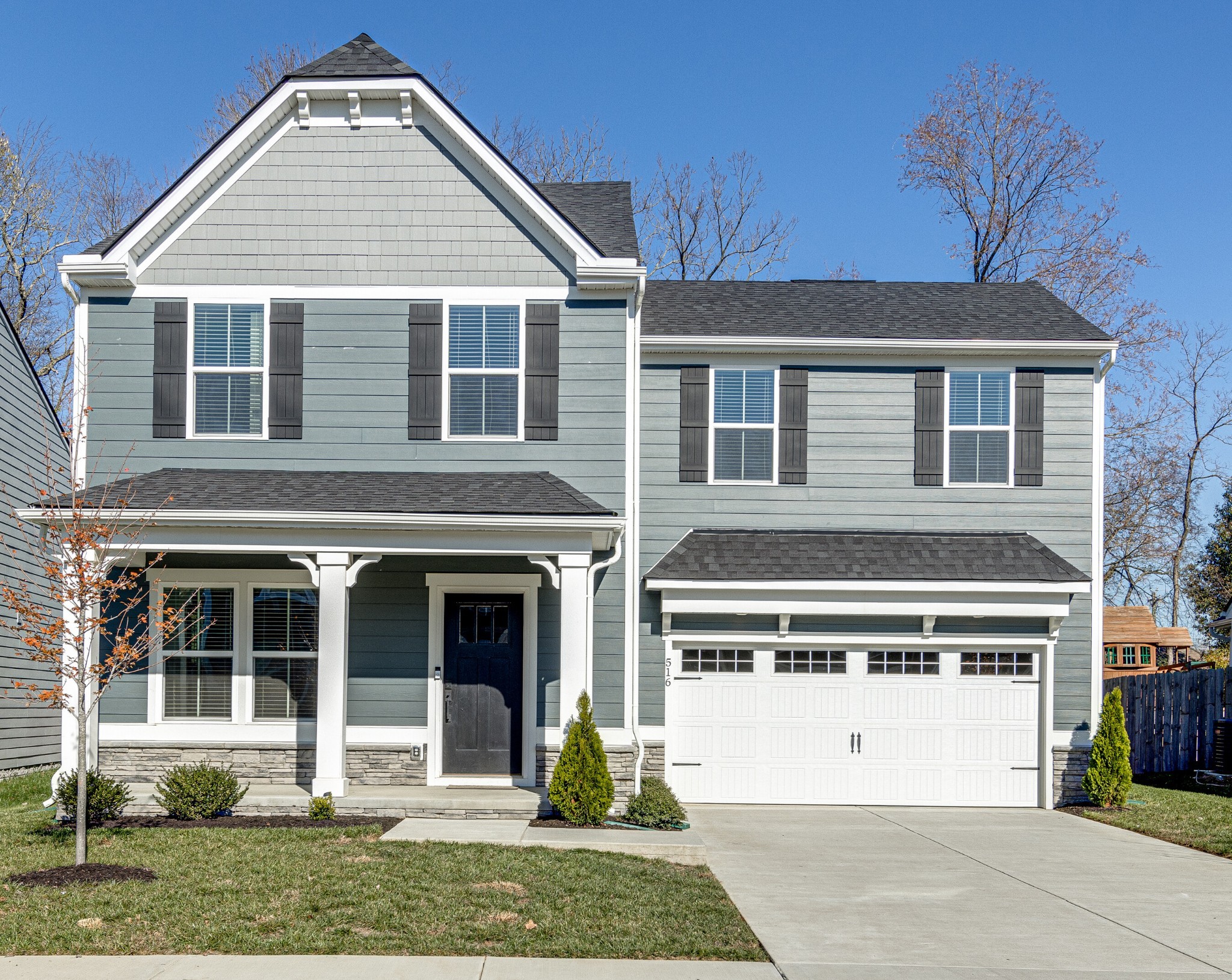 front view of a house with a yard