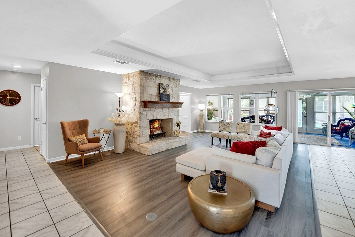 a living room with furniture and a fireplace