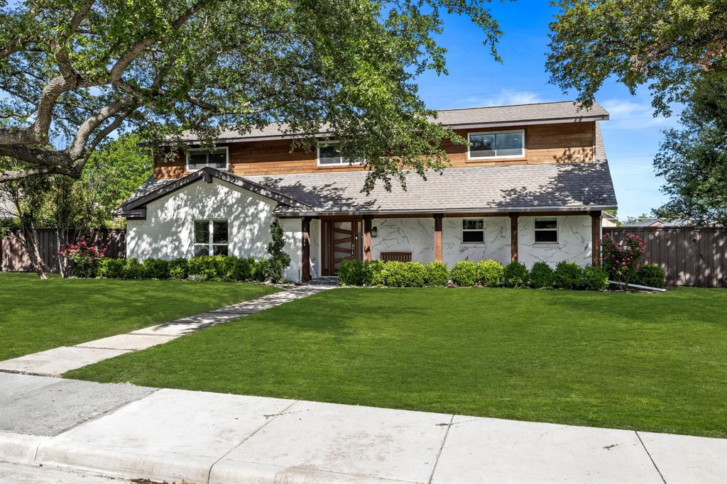 front view of a house with a yard