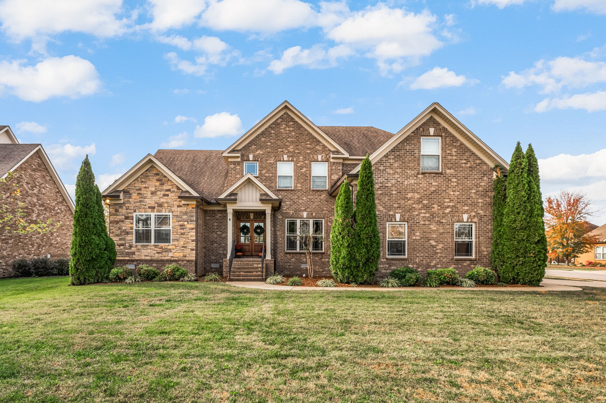 a front view of a house with garden