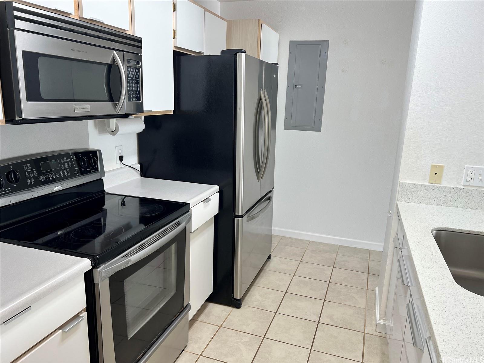 a kitchen with a stove microwave and refrigerator