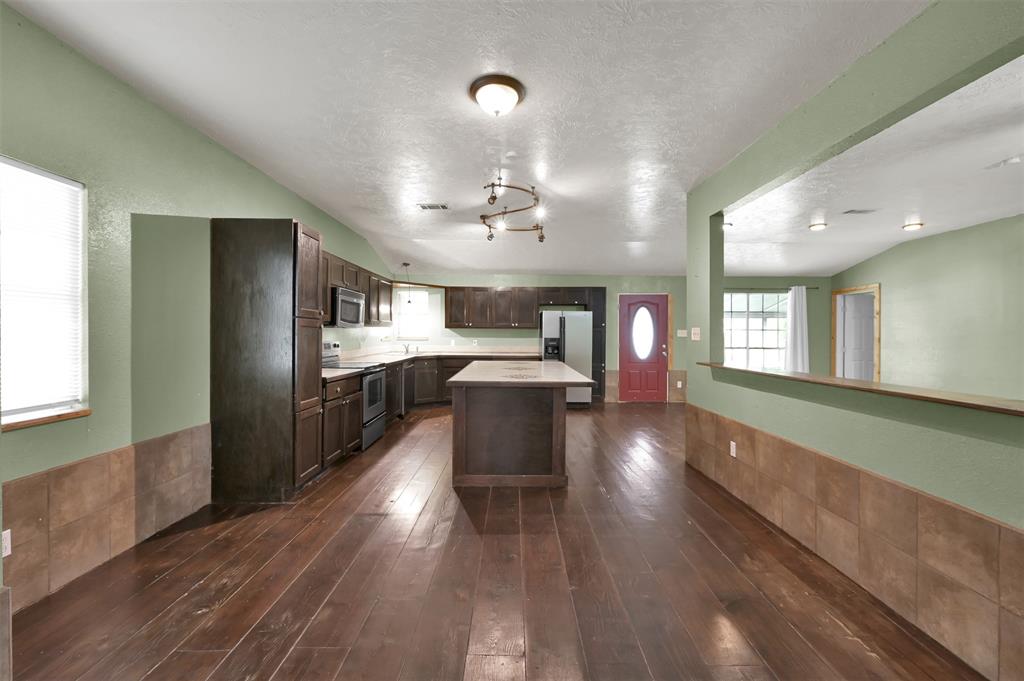 a view of a kitchen and dining room