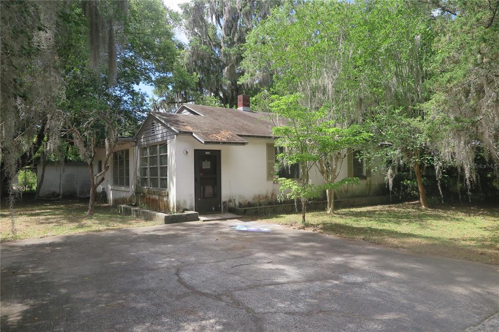 a house with trees in the background