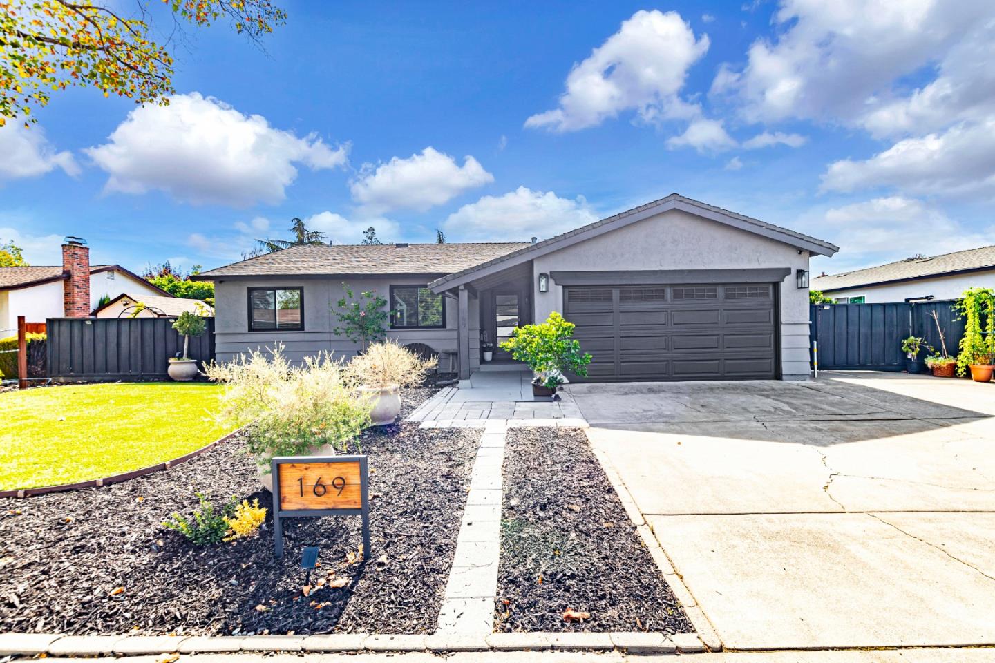 a front view of a house with garden