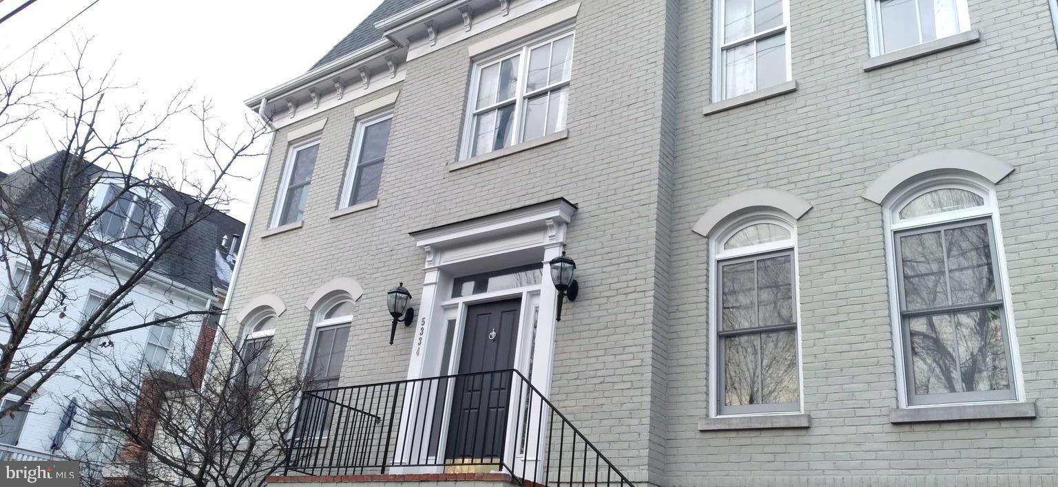 a front view of a house with a glass door