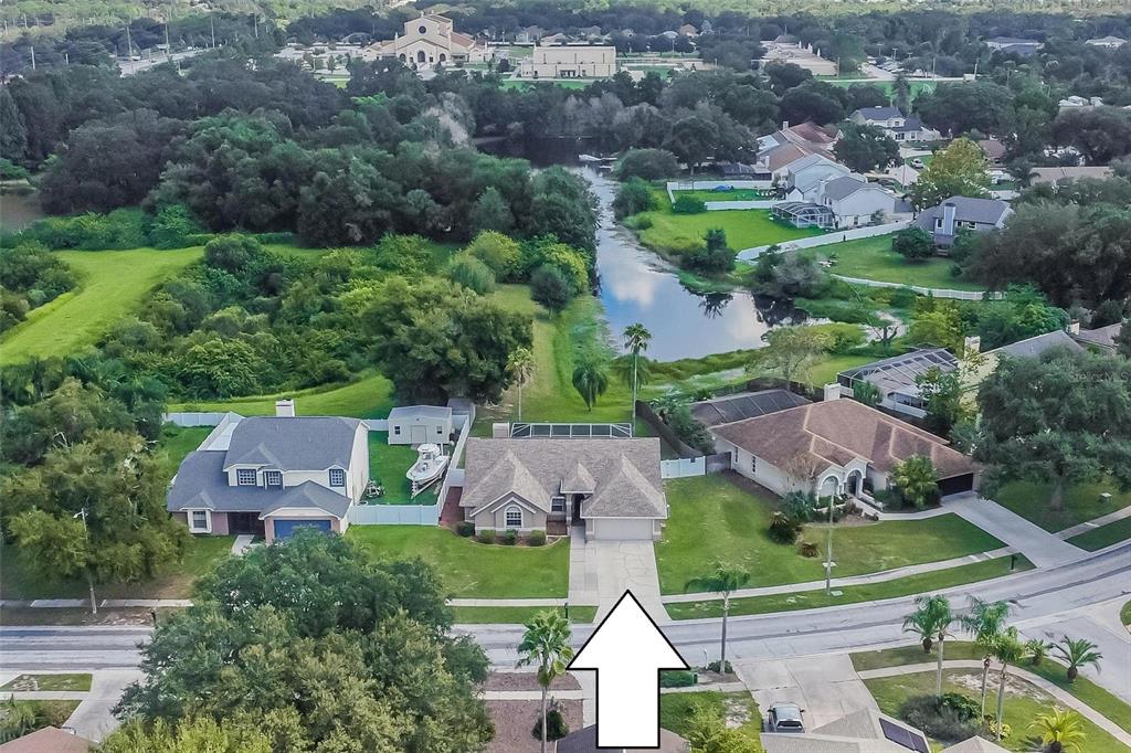 an aerial view of multiple houses with yard